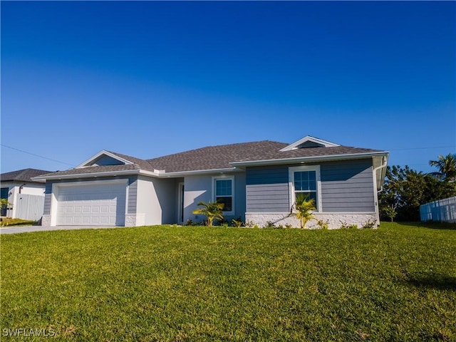 ranch-style home featuring a front yard, concrete driveway, fence, and a garage