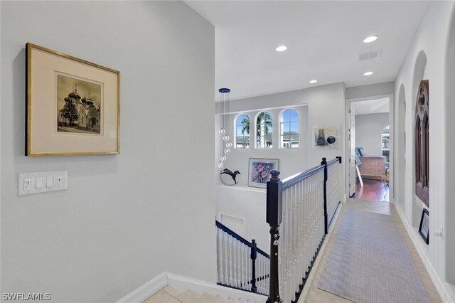 hallway with light tile patterned floors