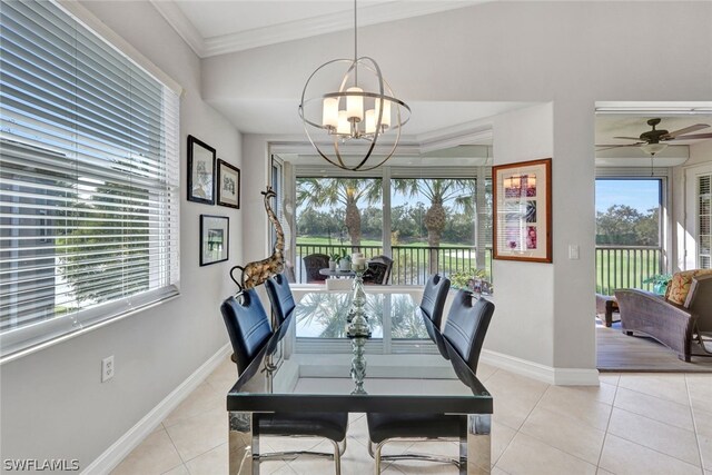 tiled dining room featuring ceiling fan with notable chandelier and ornamental molding