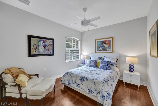 bedroom with ceiling fan and dark hardwood / wood-style floors