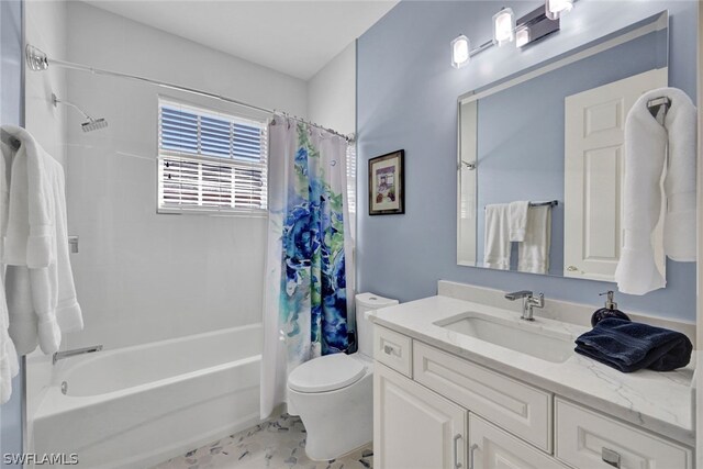 full bathroom with shower / tub combo with curtain, vanity, and toilet