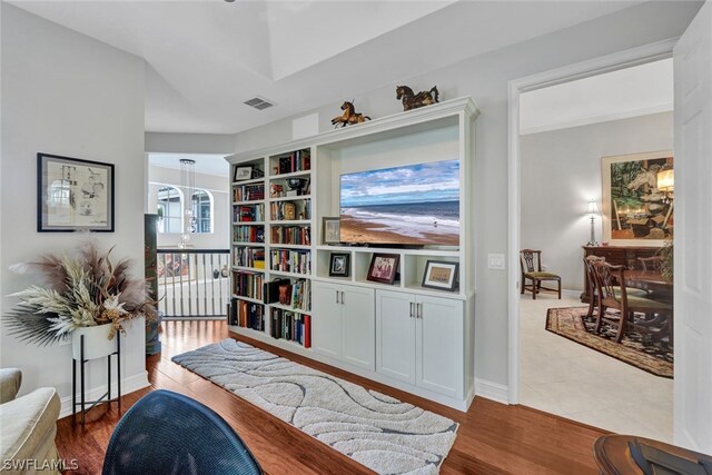 sitting room featuring light hardwood / wood-style flooring