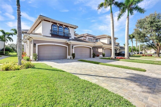 view of front of house with a front lawn and a garage