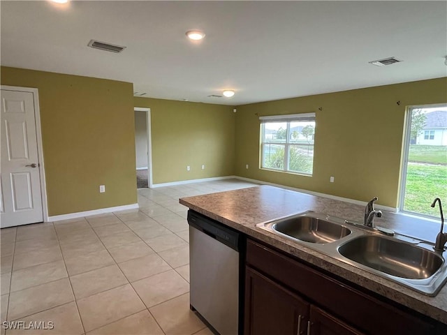 kitchen with dishwasher, light tile patterned flooring, plenty of natural light, and sink