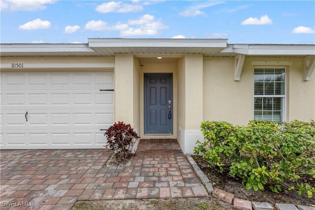 doorway to property featuring a garage