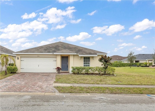 ranch-style house with a garage and a front lawn