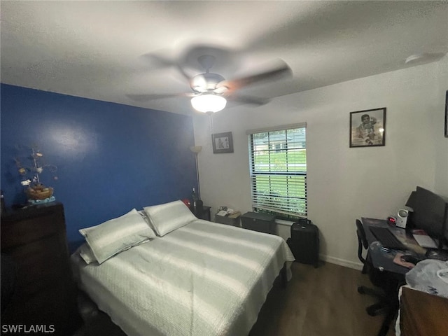 bedroom with ceiling fan and hardwood / wood-style flooring