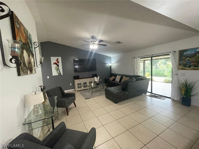 living room with light tile patterned flooring, lofted ceiling, and ceiling fan