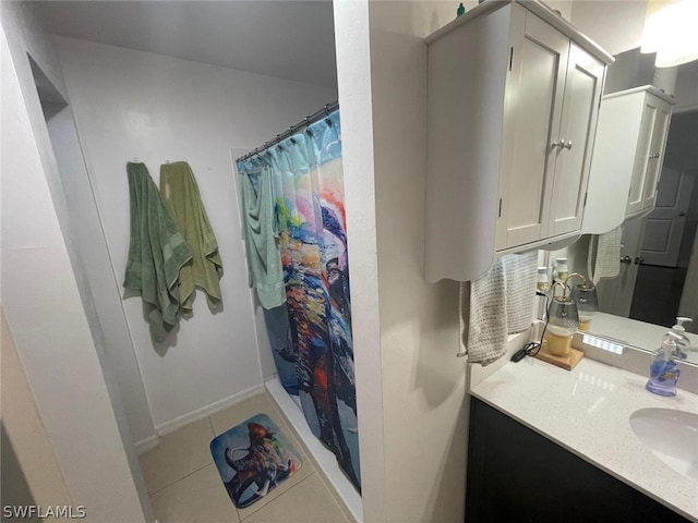 bathroom with a shower with shower curtain, vanity, and tile patterned flooring