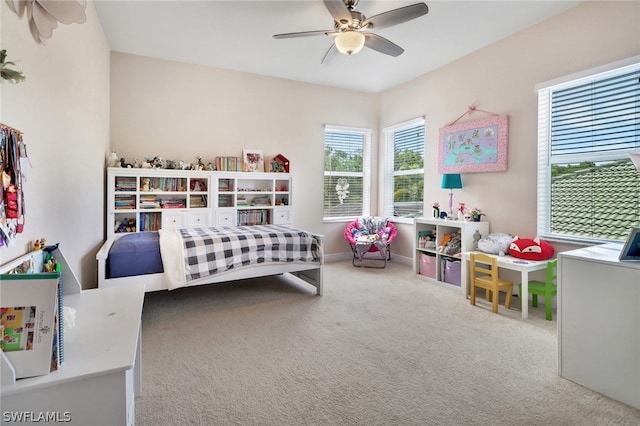 bedroom with ceiling fan and carpet floors