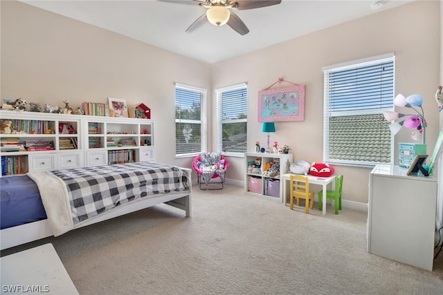 bedroom featuring ceiling fan and carpet