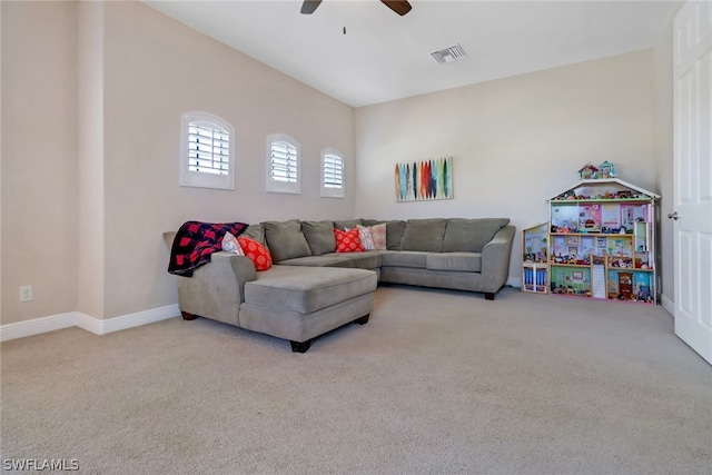 living room featuring ceiling fan and light colored carpet