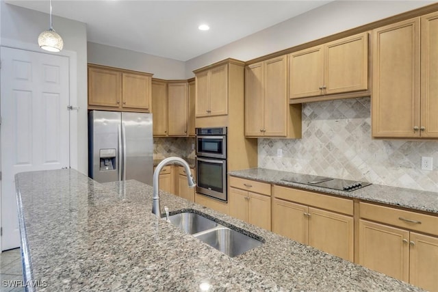 7787 Martino Cir, Naples, FL 34112 - kitchen with appliances with stainless steel finishes, light stone counters, decorative backsplash, hanging light fixtures, and recessed lighting