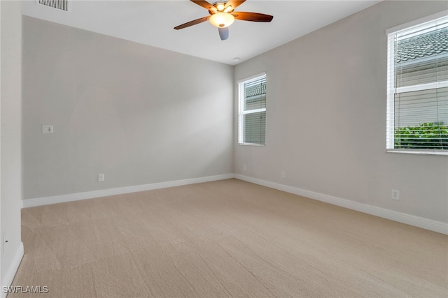 7787 Martino Cir, Naples, FL 34112 - spare room with light colored carpet and ceiling fan