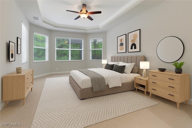 7787 Martino Cir, Naples, FL 34112 - bedroom featuring a raised ceiling, light carpet, and ceiling fan