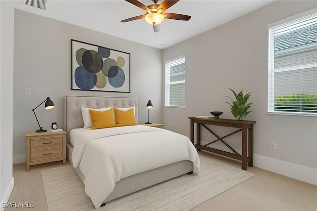 7787 Martino Cir, Naples, FL 34112 - bedroom featuring light colored carpet and ceiling fan