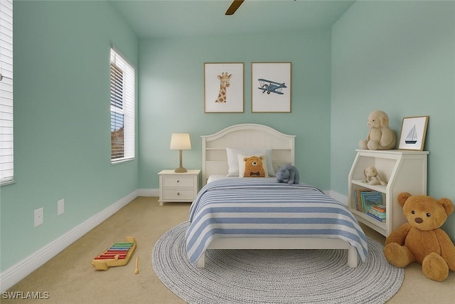 7787 Martino Cir, Naples, FL 34112 - carpeted bedroom with baseboards and ceiling fan