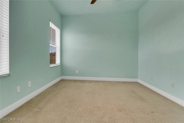 7787 Martino Cir, Naples, FL 34112 - empty room with carpet floors and ceiling fan