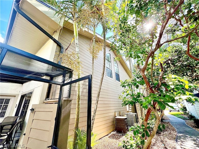 view of side of home featuring central air condition unit