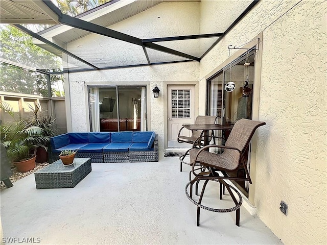 view of patio / terrace featuring a lanai and outdoor lounge area