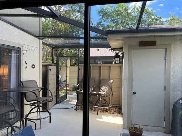 view of patio / terrace with glass enclosure