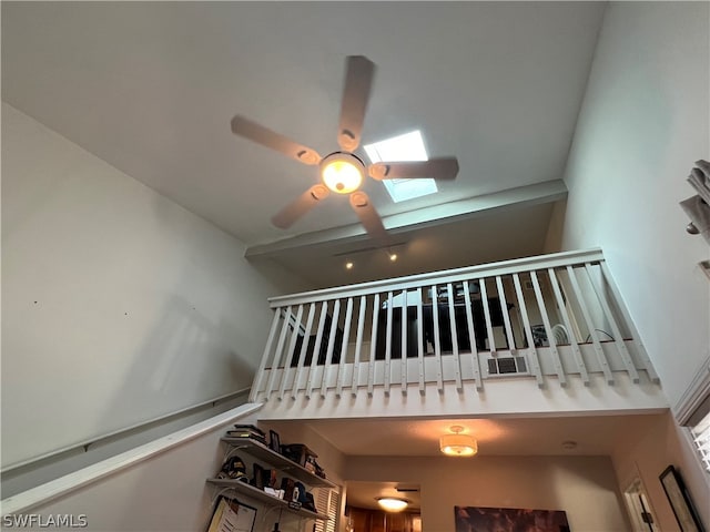 interior space with ceiling fan and a skylight