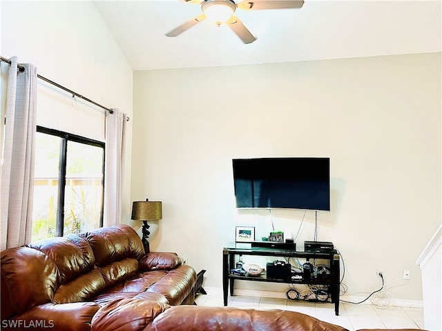 living room with ceiling fan, light tile patterned floors, and lofted ceiling