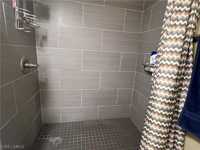 full bathroom with tiled shower