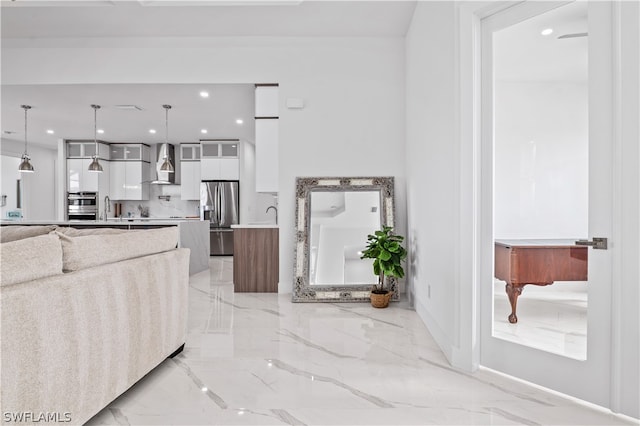 living room featuring plenty of natural light and sink