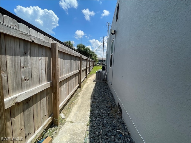 view of side of home featuring central AC unit