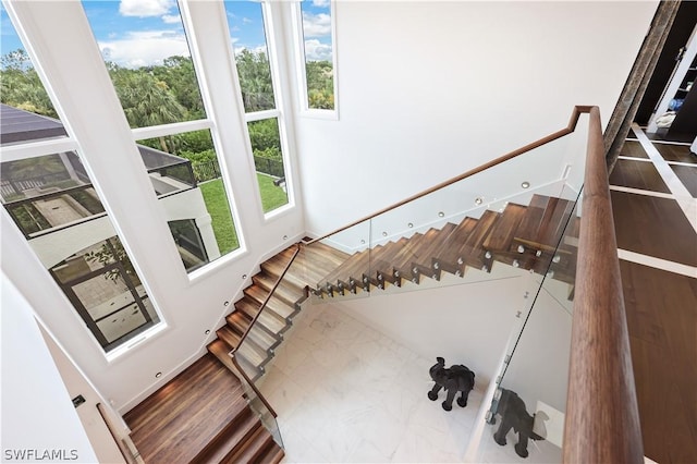 stairs featuring plenty of natural light