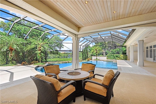 view of patio / terrace with glass enclosure