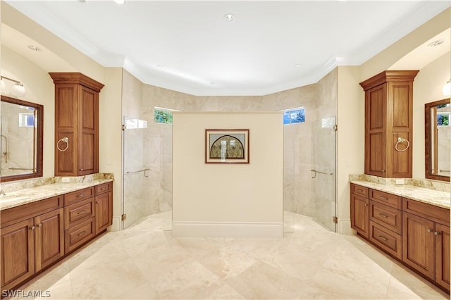 bathroom featuring vanity, a shower with door, and a wealth of natural light