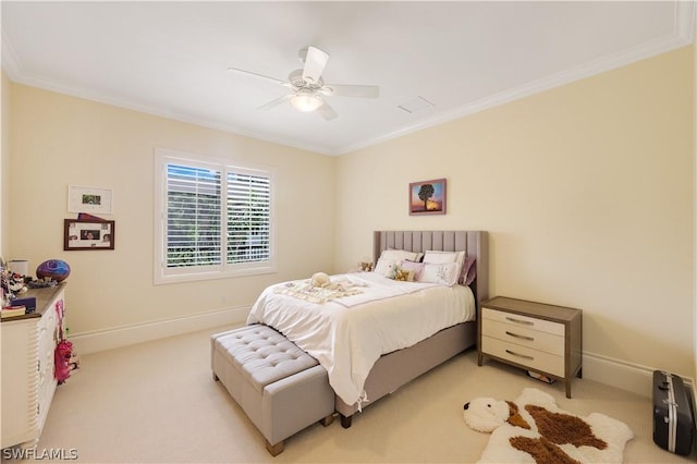 bedroom featuring crown molding, light colored carpet, and ceiling fan