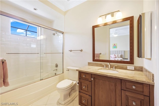 full bathroom with combined bath / shower with glass door, tile patterned flooring, vanity, ornamental molding, and toilet