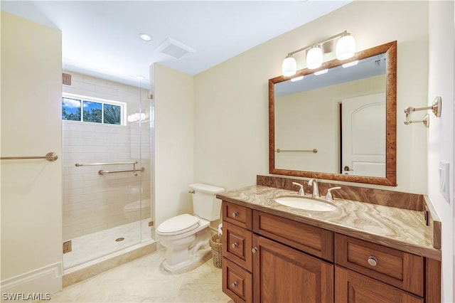 bathroom with vanity, toilet, and an enclosed shower