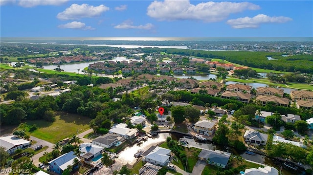 bird's eye view featuring a water view and a residential view