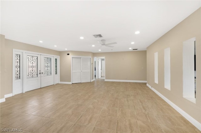 3461 Lakeview Dr, Naples, FL 34112 - empty room featuring a ceiling fan, recessed lighting, baseboards, french doors, and light tile patterned floors