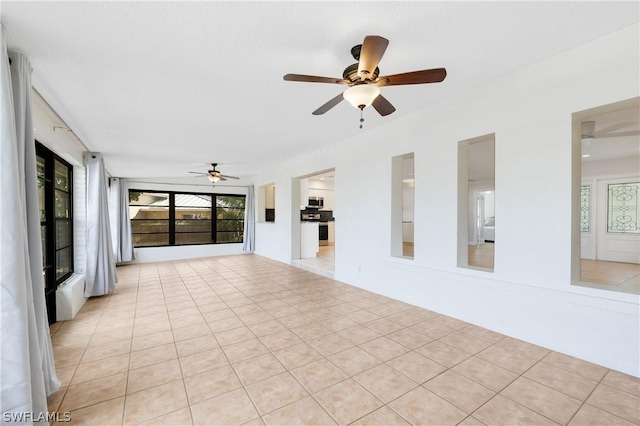 unfurnished room with light tile patterned floors