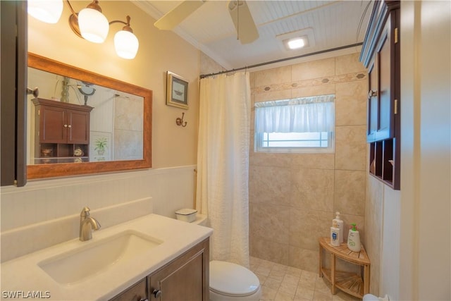 bathroom with curtained shower, toilet, vanity, and crown molding