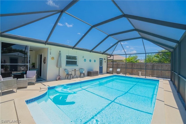 view of pool with an outdoor hangout area, a patio, and a lanai