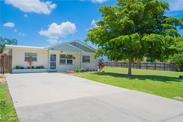 single story home with a front yard