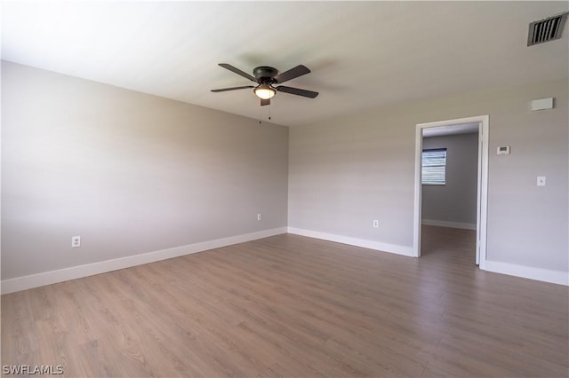 3325 Airport Rd N Unit S8, Naples, FL 34105 - empty room with ceiling fan and wood finished floors