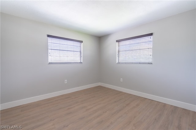 spare room with hardwood / wood-style flooring