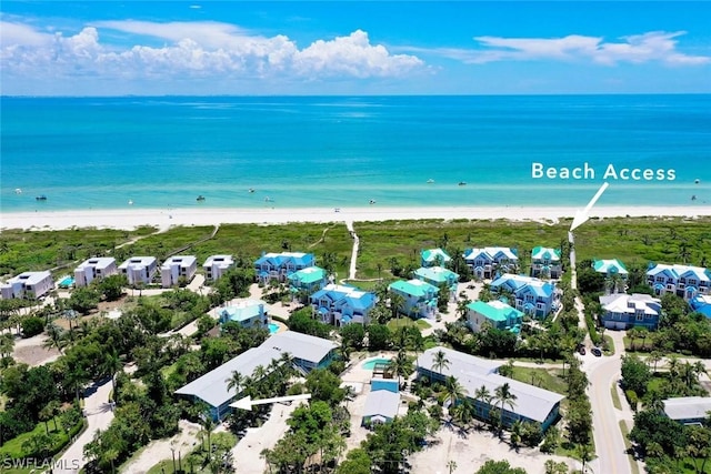 bird's eye view with a beach view and a water view