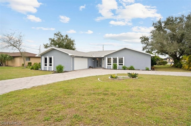 single story home featuring a garage and a front yard