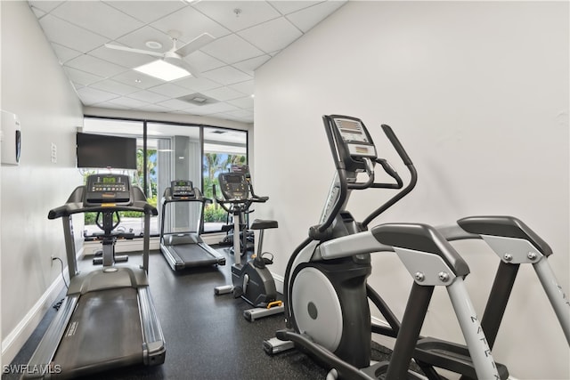 exercise room with a paneled ceiling