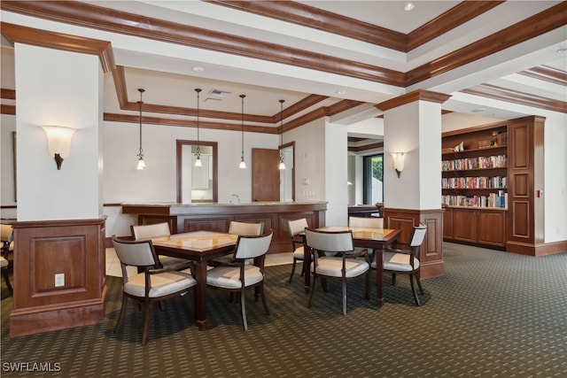 dining space featuring ornamental molding and dark carpet