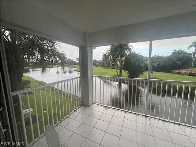 balcony featuring a water view