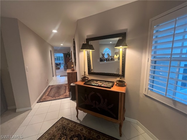 hallway featuring light tile patterned floors